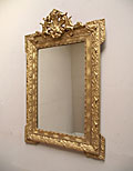 small gilded crested mirror